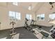 Bright fitness center with various exercise machines and views from multiple windows at 4987 Kyle Dr, Powder Springs, GA 30127