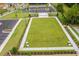 Aerial view of a sprawling green lawn with decorative chairs, landscaped pathways, and a parking lot at 4987 Kyle Dr, Powder Springs, GA 30127