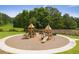 Well maintained community playground with slides, stairs, and benches surrounded by mulch at 4987 Kyle Dr, Powder Springs, GA 30127