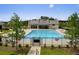 A clear view of the pool house and swimming pool with an iron fence around the perimeter at 4987 Kyle Dr, Powder Springs, GA 30127