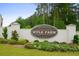 Kyle Farm community sign surrounded by well-maintained landscaping and greenery at 4987 Kyle Dr, Powder Springs, GA 30127