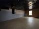 Unfinished basement area with concrete floor, window, insulation and black plastic sheet on ceiling at 675 Paper Creek Dr, Lawrenceville, GA 30046