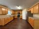 Well-equipped kitchen with stainless steel appliances and wood cabinets at 675 Paper Creek Dr, Lawrenceville, GA 30046