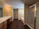 Spacious bathroom featuring dual sinks, a large mirror, a walk-in shower and a bathtub at 675 Paper Creek Dr, Lawrenceville, GA 30046