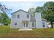 Exterior of house featuring a backyard with double doors and a concrete patio at 1109 Willow Crest Way, Austell, GA 30168