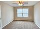 Bedroom featuring carpeted floors, a ceiling fan, and a bright window at 1109 Willow Crest Way, Austell, GA 30168