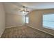 Spacious bedroom featuring neutral walls, carpeted floors, and a modern ceiling fan at 1109 Willow Crest Way, Austell, GA 30168