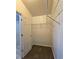 Walk-in closet with carpeted floors, wire shelving, and a view of the shower at 1109 Willow Crest Way, Austell, GA 30168