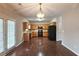 Spacious kitchen with wooden cabinets, black appliances, and hardwood floors at 1109 Willow Crest Way, Austell, GA 30168