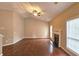 Bright living room with hardwood floors, fireplace, and large windows offering plenty of natural light at 1109 Willow Crest Way, Austell, GA 30168