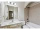 Bright bathroom with a bathtub, tiled shower, and vanity at 3023 Lawson Dr, Marietta, GA 30064