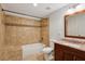 Bathroom features a tile surround tub and shower, modern vanity, and neutral walls at 3023 Lawson Dr, Marietta, GA 30064