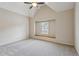 Large bedroom with plush carpeting, built in window seat, and neutral walls at 3023 Lawson Dr, Marietta, GA 30064