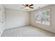 Cozy bedroom featuring neutral walls, plush carpeting, and a window that offers natural light at 3023 Lawson Dr, Marietta, GA 30064