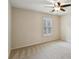 Bedroom features neutral walls, plush carpeting, ceiling fan, and a window that offers natural light at 3023 Lawson Dr, Marietta, GA 30064
