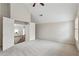 Spacious bedroom featuring neutral walls, plush carpeting, and a vaulted ceiling at 3023 Lawson Dr, Marietta, GA 30064
