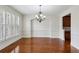 Formal dining room features hardwood floors, elegant chandelier, and wainscoting at 3023 Lawson Dr, Marietta, GA 30064