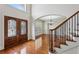 Inviting foyer with hardwood floors, staircase, and elegant entryway with stained-glass doors at 3023 Lawson Dr, Marietta, GA 30064