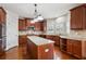 Well-equipped kitchen with an island, stainless steel microwave, and gorgeous wood cabinets at 3023 Lawson Dr, Marietta, GA 30064