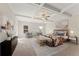Spacious bedroom featuring a tray ceiling, sitting area, and neutral decor at 53 Colonial Ter, Villa Rica, GA 30180
