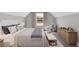 Cozy bedroom featuring a large bed, decorative pillows, and a view to the outdoors at 53 Colonial Ter, Villa Rica, GA 30180