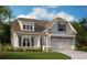 Charming two-story home showcasing meticulous landscaping and inviting curb appeal in a peaceful neighborhood at 53 Colonial Ter, Villa Rica, GA 30180