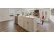 Spacious kitchen island offering additional seating and prep space, blending into the open-concept living area at 53 Colonial Ter, Villa Rica, GA 30180