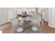 Bright kitchen and dining area with island, ideal for Gathering meals and entertaining in style at 53 Colonial Ter, Villa Rica, GA 30180