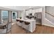 Modern kitchen with stainless steel appliances, a large island with seating, and stylish finishes at 53 Colonial Ter, Villa Rica, GA 30180