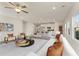 Bright and airy living space with seamless flow into a modern kitchen featuring an island with barstool seating at 53 Colonial Ter, Villa Rica, GA 30180