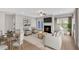 Bright living room with fireplace, modern furnishings, and hardwood floors, ideal for relaxation at 53 Colonial Ter, Villa Rica, GA 30180