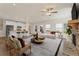 Open-concept living area featuring a cozy fireplace, seamlessly blending the kitchen, dining, and lounging spaces at 53 Colonial Ter, Villa Rica, GA 30180
