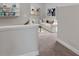 Bright living room features white sofa, decor shelving, and contemporary artwork at 53 Colonial Ter, Villa Rica, GA 30180