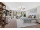 A spacious main bedroom features decor shelving, a ceiling fan, a large window, and a sitting area at 53 Colonial Ter, Villa Rica, GA 30180