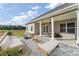 Charming outdoor patio features stone floors and a covered seating area at 53 Colonial Ter, Villa Rica, GA 30180
