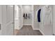 Spacious walk-in closet with ample storage and neutral carpeting at 53 Colonial Ter, Villa Rica, GA 30180