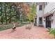 This backyard has a brick patio, chiminea and mature landscaping at 643 Longstreet Dr, Marietta, GA 30064