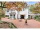 This backyard has a brick patio, covered porch, and mature landscaping at 643 Longstreet Dr, Marietta, GA 30064
