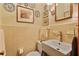 This powder room features a square sink and toilet plus decor at 643 Longstreet Dr, Marietta, GA 30064
