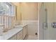 Clean bathroom with glass shower, white marble sink and counter top, and tiled floors at 643 Longstreet Dr, Marietta, GA 30064