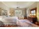 Bedroom with hard wood floors, natural lighting, a ceiling fan and a comfortable seating area at 643 Longstreet Dr, Marietta, GA 30064