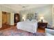 Spacious bedroom features hardwood floors, ceiling fan, large bed, and plenty of natural light at 643 Longstreet Dr, Marietta, GA 30064