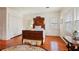 This bedroom showcases a large carved wood bed frame, hardwood flooring, and a classic aesthetic at 643 Longstreet Dr, Marietta, GA 30064