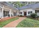 Inviting front porch with rocking chairs and a brick walkway leading to the front door at 643 Longstreet Dr, Marietta, GA 30064