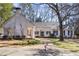 Beautiful white brick home with a brick walkway, covered porch swing, and mature landscaping at 643 Longstreet Dr, Marietta, GA 30064
