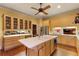 Bright eat-in kitchen featuring custom cabinets, large island, and stainless steel appliances at 643 Longstreet Dr, Marietta, GA 30064