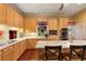 Bright eat-in kitchen featuring custom cabinets, stainless steel appliances, and hardwood floors at 643 Longstreet Dr, Marietta, GA 30064