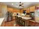 Spacious kitchen featuring stainless steel appliances, an island with bar seating, and hardwood floors at 643 Longstreet Dr, Marietta, GA 30064