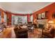 Cozy living room with a fireplace, bay window, hardwood floors, and comfortable seating at 643 Longstreet Dr, Marietta, GA 30064