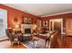 Warm and inviting living room with hardwood floors, a fireplace, and traditional decor at 643 Longstreet Dr, Marietta, GA 30064